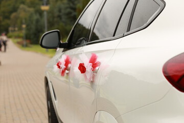 wedding decoration on white car