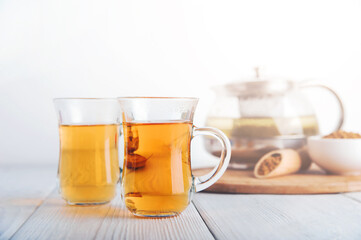Superfood Taiwan Ku Qiao buckwheat tea in teapot and transparent cups close-up and copy space..