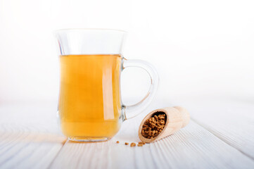 Superfood Taiwan Ku Qiao buckwheat tea in teapot and transparent cups close-up and copy space..