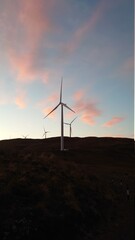 Obraz premium wind turbine at sunset