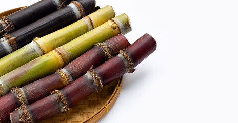 Sugar cane in bamboo basket on white background.