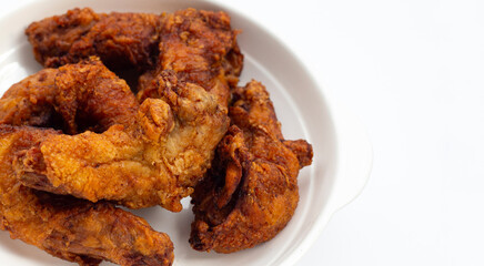 Fried chicken necks on white background.