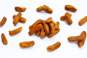 Sun-dried bananas on white background.