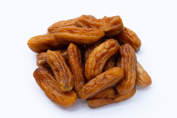 Sun-dried bananas on white background.