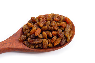 Dried grape raisins in wooden spoon on white background