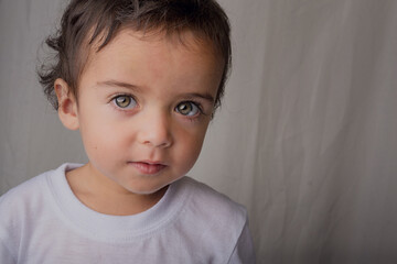 portrait of little boy with big expressive eyes