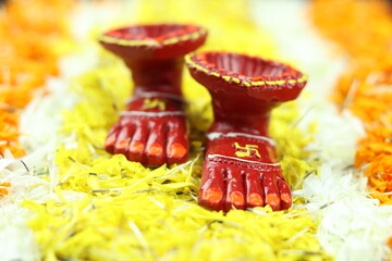 Hindu Goddess Sacred Feet Painted In Red Called Laxmi Charan With Deep In Walking Pose On Marigold...