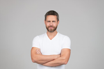 Being confident as a man. Confident unshaven man grey background. Confidence