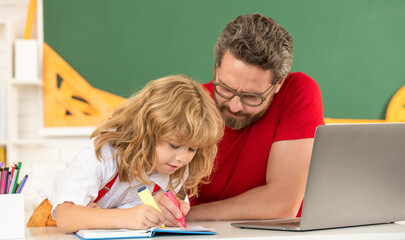 teacher and child study in classroom with laptop, family