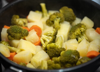 healthy food. macro photography of broccoli, carrots and potatoes. image with blurred space for copy.