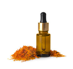 Bottle of saffron essential oil on white background