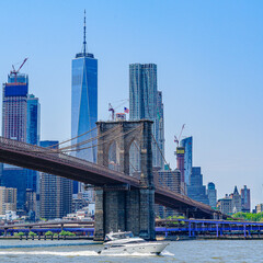 Brooklyn Bridge with lower Manhattan skyline, One World Trade Center in New York City.