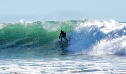 Surfer Shooting the Curl at Rincon Beach, California