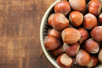 hazelnuts close-up in a cup on a wooden table.Vegetable protein source. healthy snack. Healthy fats. Farmed organic ripe hazelnuts. High quality photo