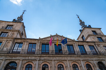 Fototapeta premium Looking up towers the Skies with the Ayuntamiento the Toledo Building in the foreground
