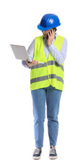 Female construction worker with laptop talking by mobile phone on white background