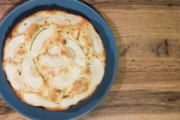 Close-up Apple Pie on gray plate on a Brown Rustic Wooden Background. Flat lay with copy space