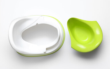 Modern baby potty on white background