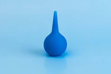 Blue baby enema isolated on the blue background