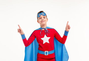 Little superhero smiling and pointing up