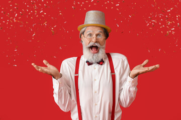 Fototapeta na wymiar Happy Santa Claus and falling confetti on color background