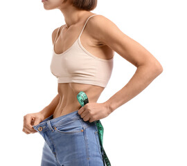 Young woman with measuring tape on white background. Anorexia concept