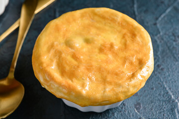 Tasty vegetable pot pie on black background, closeup