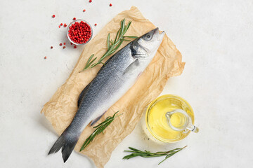 Fresh uncooked sea bass fish on white background