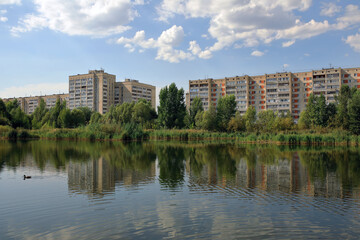Fototapeta na wymiar View of the residential area near the park and Lake Kharovoe. City of Kazan, Republic of Tatarstan, Russia.