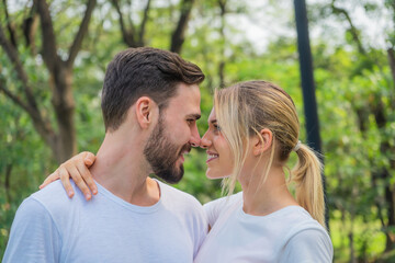 caucasian couple having romanatic moment together in park