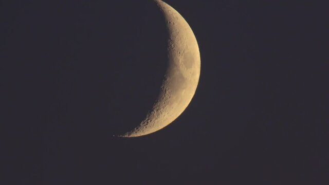 Half moon moving on the night sky dome in the perigeum.