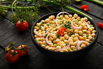 Homemade delicious chickpeas salad with herbs.