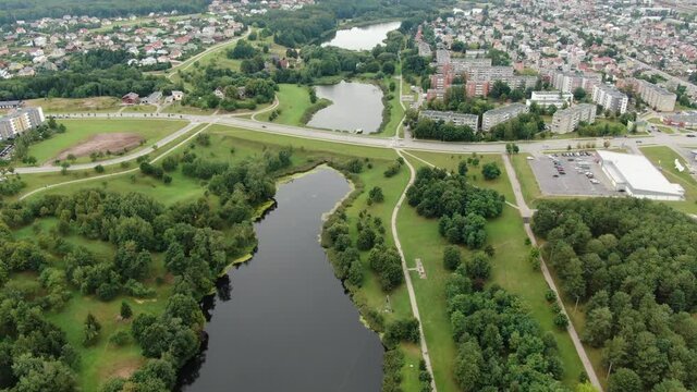 Living district of Jonava city surrounds small water ponds, aerial drone view