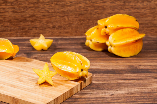 Averrhoa Carambolo - Star Fruit Or Carambola; Photo On Wooden Background