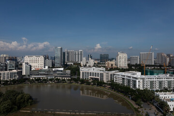 Ultra modern city and lake reflection on sunny, clear day featuring a mixture of architectural styles.