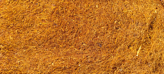 Photo background of the texture of chopped tobacco leaves that have been dried in the Cikancung area, Indonesia