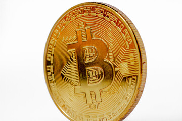 Front view of bitcoin with slightly tilted composition, has a gold color isolated on white background, for payment, investment, finance and economy concept