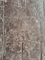 Old brown stone pattern paving slabs.