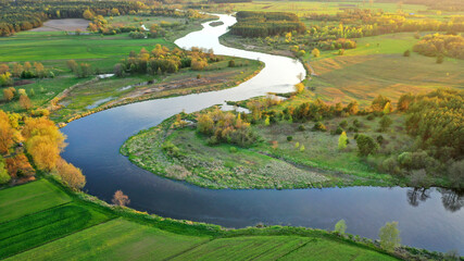 Aerial view of natural river during morning - obrazy, fototapety, plakaty