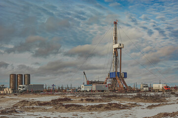 A harmonious combination of nature and the technogenic landscape of an oil and gas field with a...