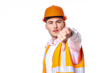 working man in orange uniform posing construction