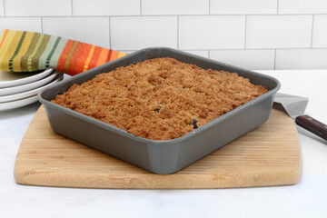 Blueberry Coffee cake with crumb topping in baking pan.
