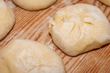 Fototapeta na wymiar langos, raw dough with cheese 