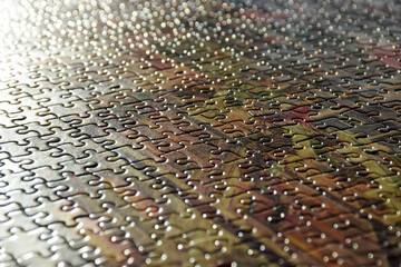Close up detail of complete jigsaw puzzle in sunlight