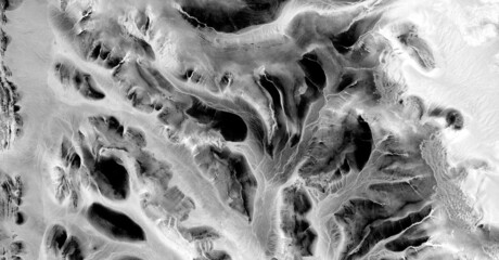   abstract photography of the deserts of Africa from the air in black and white, aerial view of...