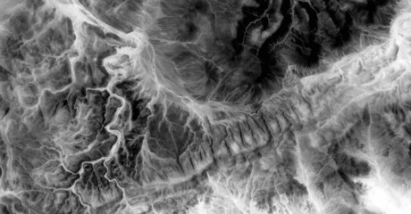   abstract photography of the deserts of Africa from the air in black and white, aerial view of...