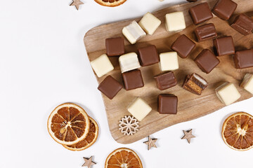 German Christmas candy called 'Dominosteine' consisting of gingerbread, jelly and marzipan layers covered with chocolate icing