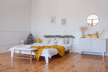 New Year Scandinavian trendy interior style. Christmas tree in basket, mustard orange plaid
