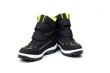 Demi-season teenage boots in dark gray with Velcro fasteners shot against a white background.