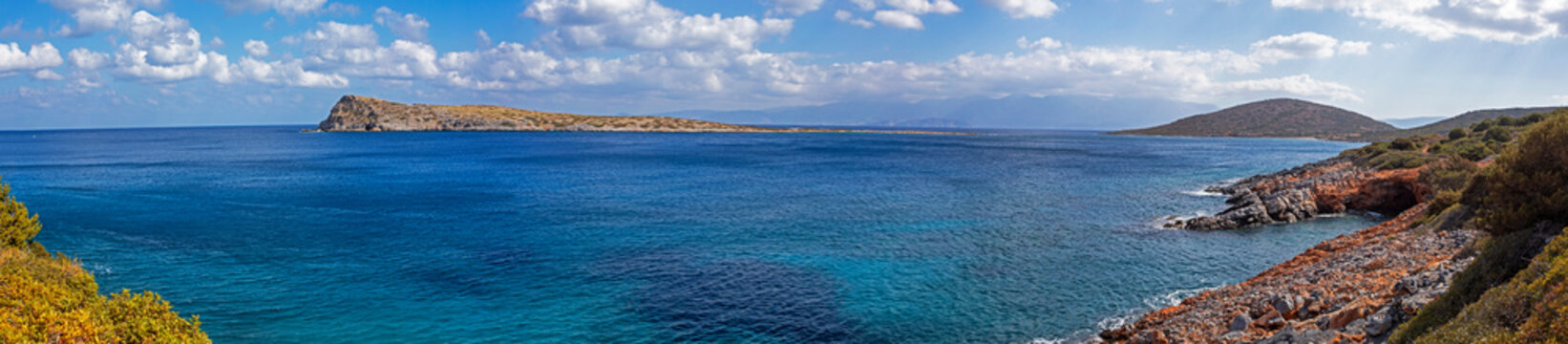 beautiful panoramic view with clouds from the bay near the sunken city of Olus, on the island of Crete on a sunny day, windy day, horizontal.